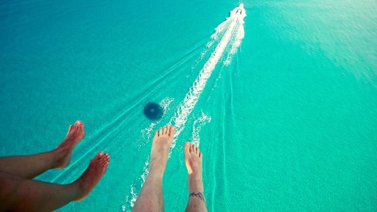 atardecer aventura parasailing